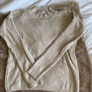 Cream mock neck sweater.